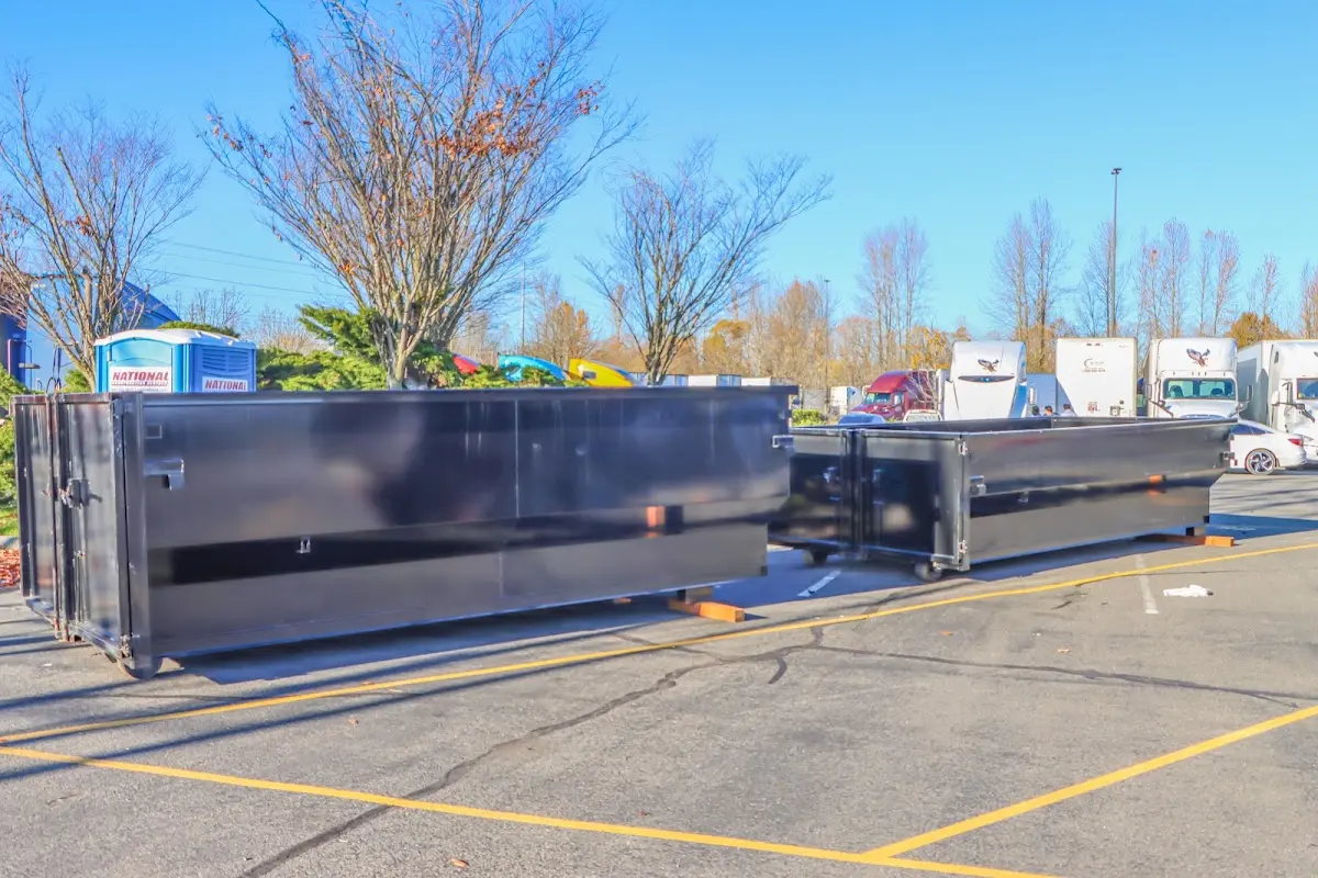 Professional dumpster rental service with roll-off container on residential driveway in South San Francisco
